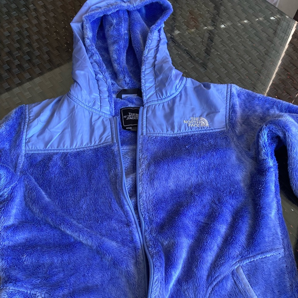 The North Face fuzzy zip up jacket with packets and hood.